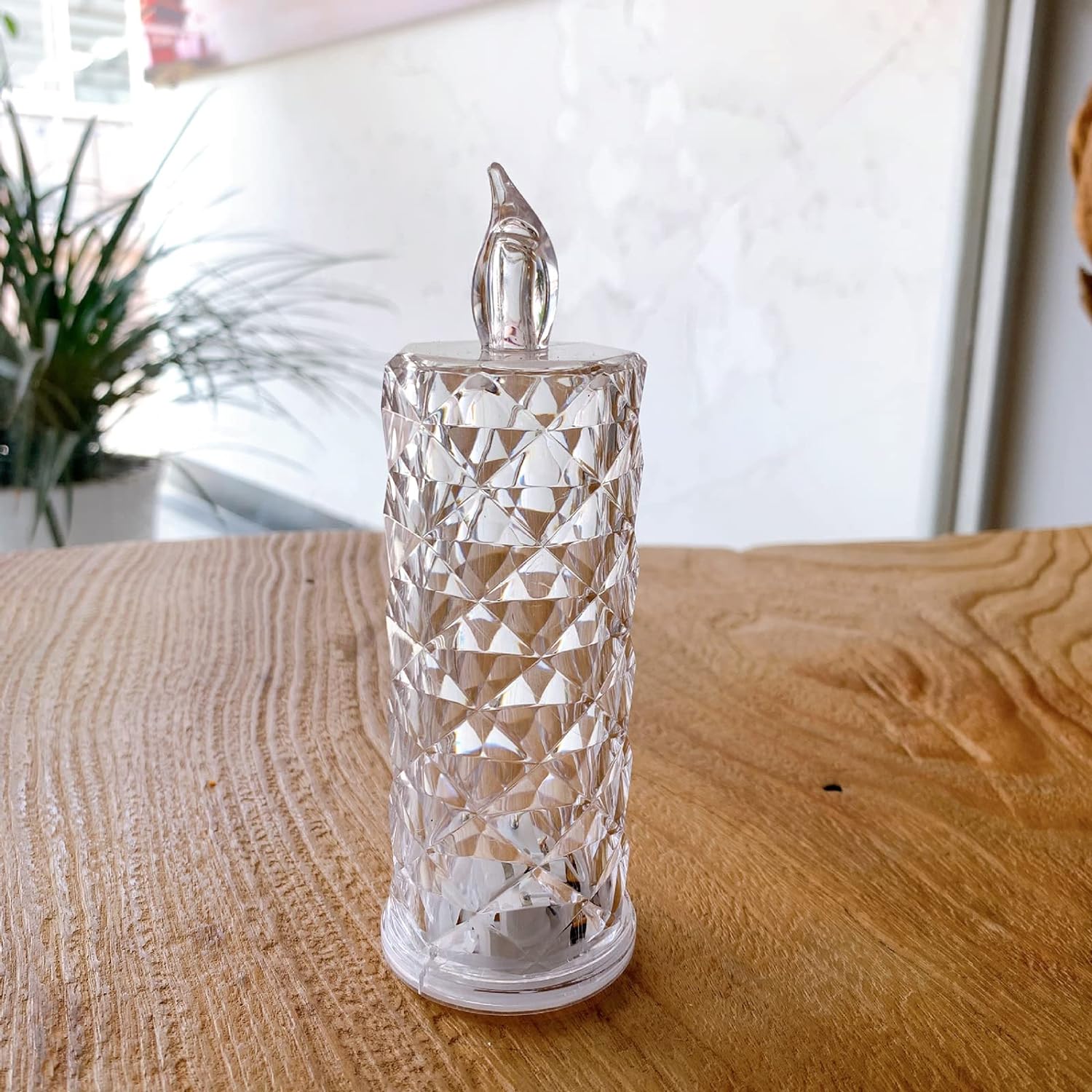 Smokeless LED rose candle in acrylic, showcasing a decorative and flameless design. Smokeless LED rose candle in acrylic, showcasing a decorative and flameless design.